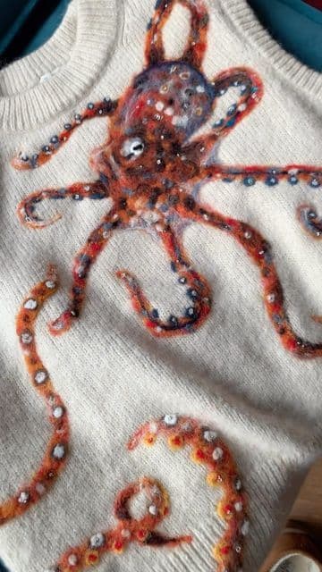 Felt octopus on a white knitted tank top