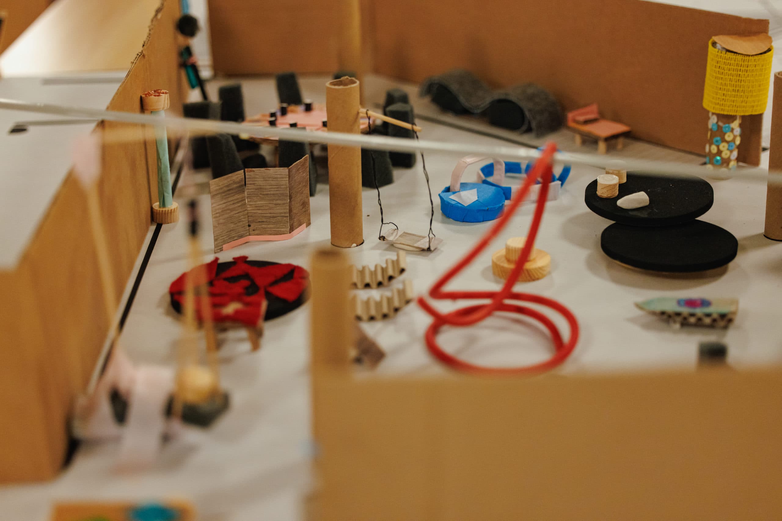 Architectural model made from cardboard, string, wood and other recycled materials.